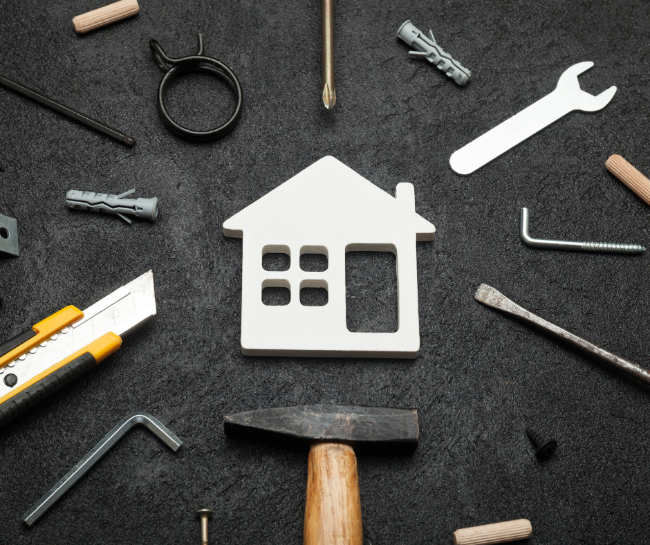 house cutout in the middle of a collection of tools