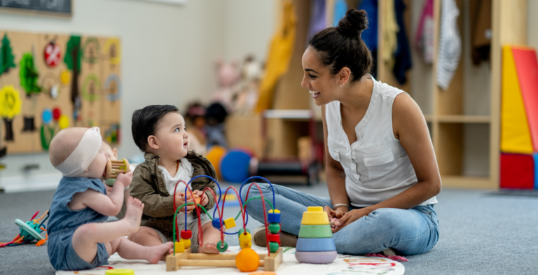 Daycare provider playing with kids