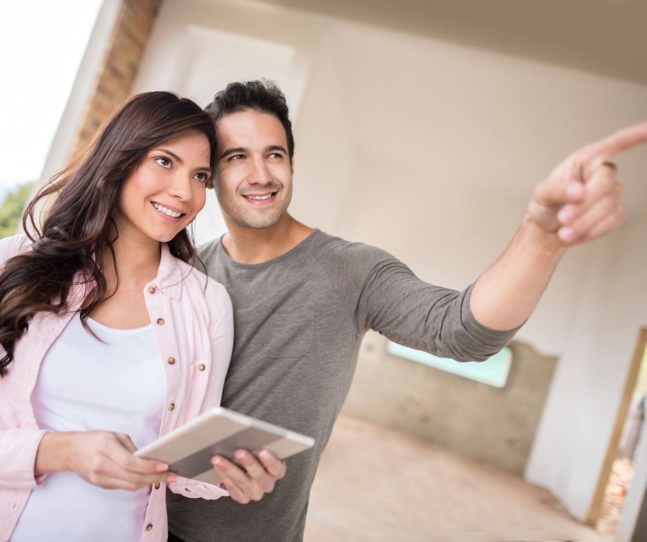 Happy couple planning out a remodel of home