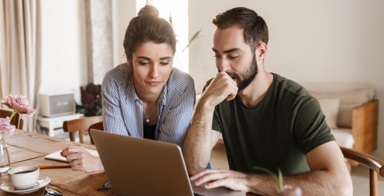 Couple on computer looking at loans for a home remodel