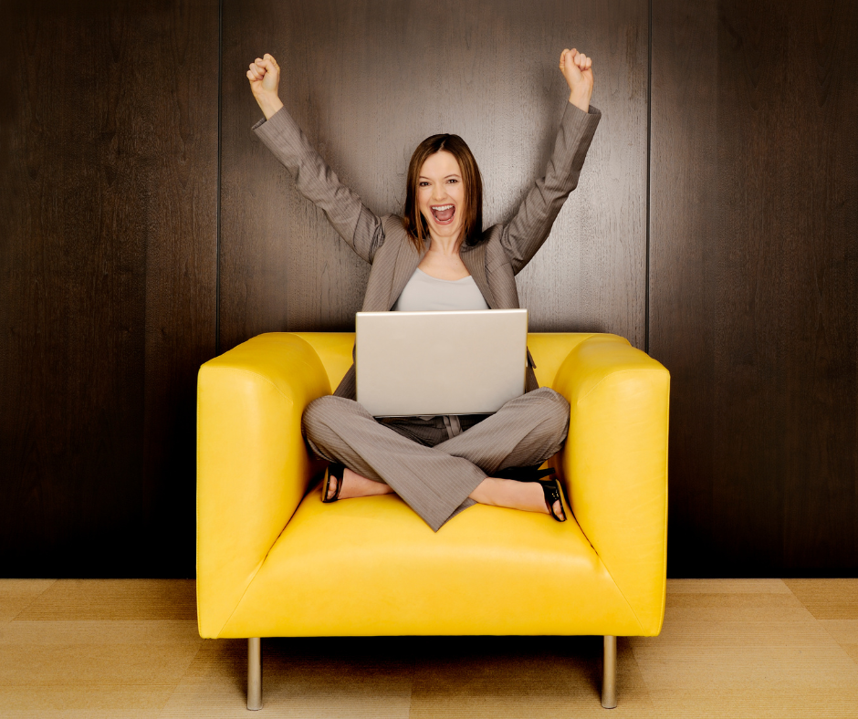 Woman in yellow chair excited about a financial win