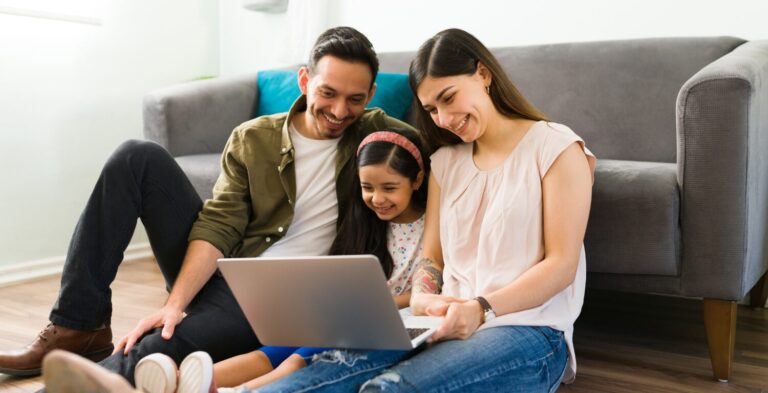 Parents and kid using computer